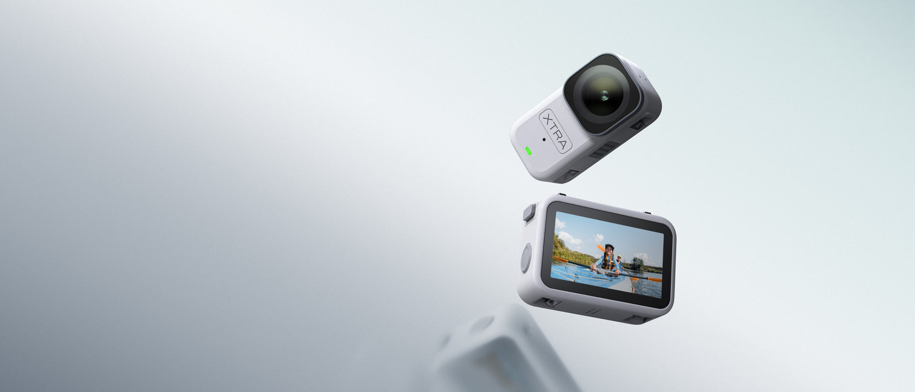 XTRA ATTO wearable camera and screen dock on a light background