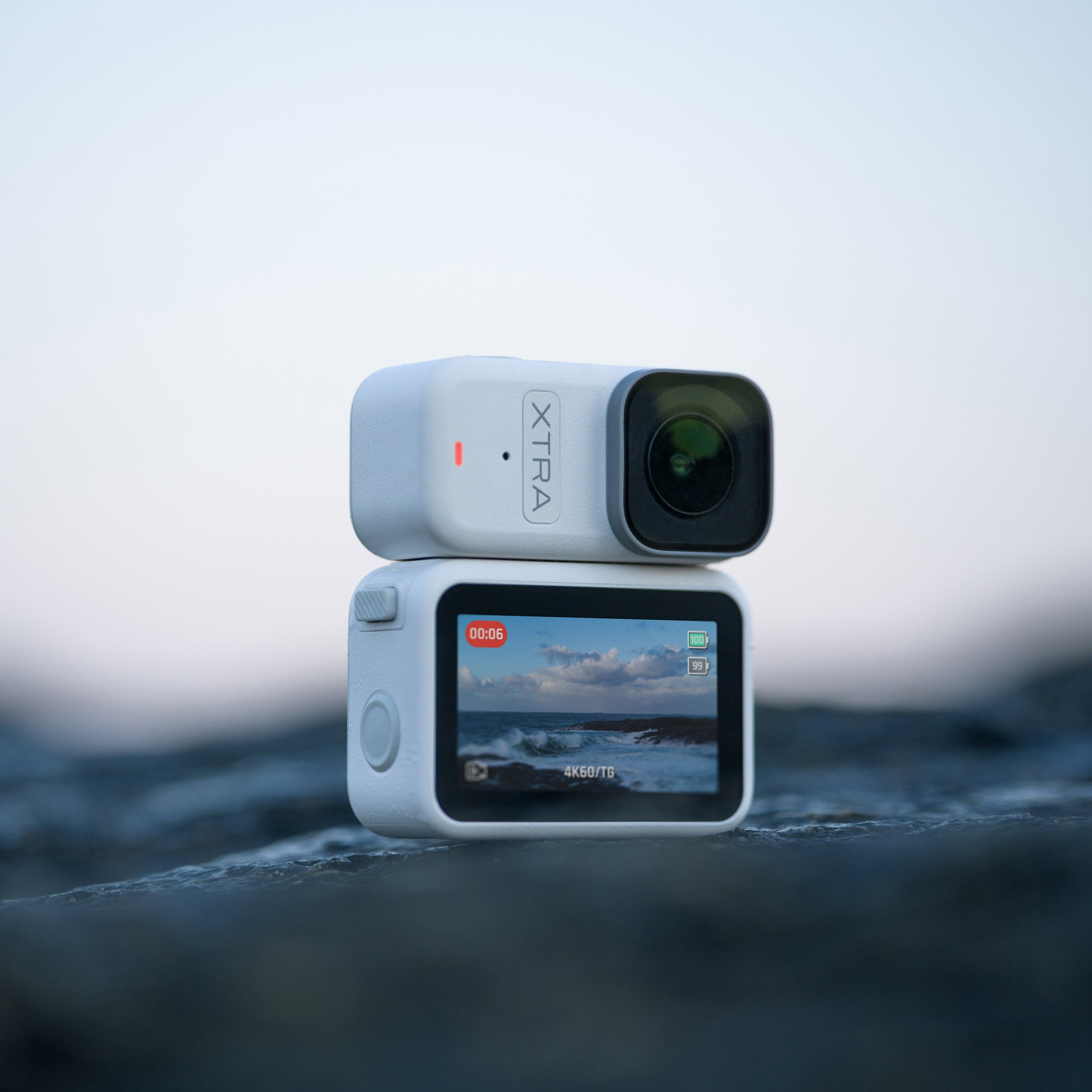 Xtra Atto magnetic vlog camera mounted on Vision Dock with OLED touchscreen display showing 4K footage